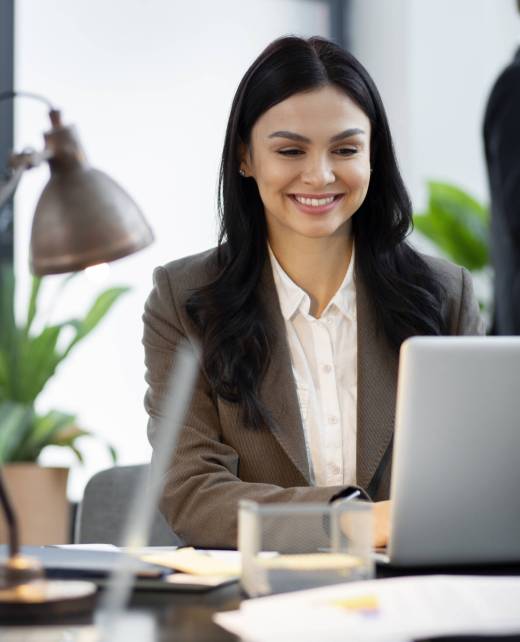 close-up-smiley-woman-working-laptop